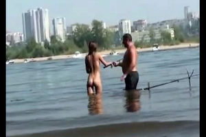 Bare damsels on the beach for swingers